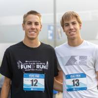 Two participants posing for a photo before the fun(d) run